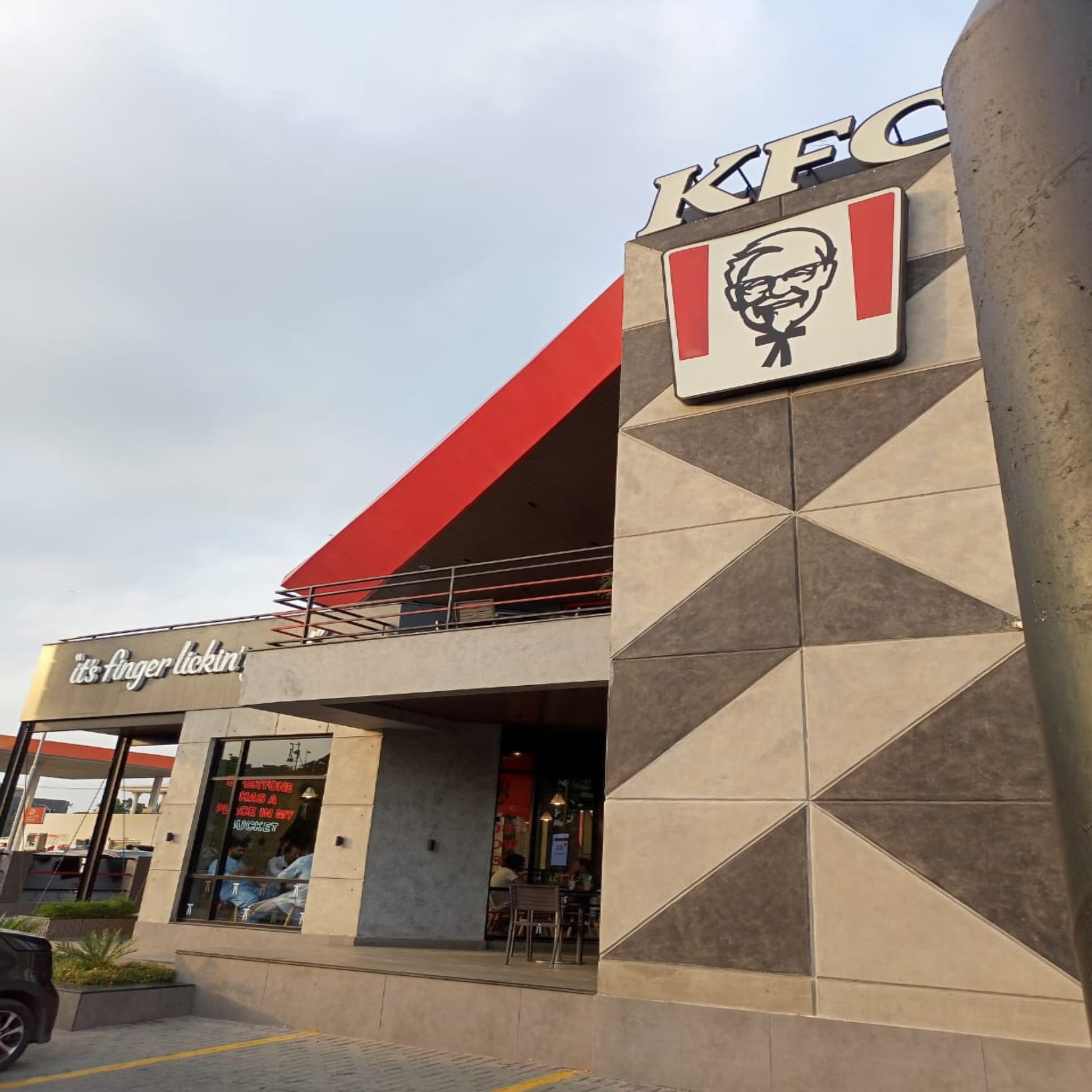 KFC restaurant exterior with logo on a building facade