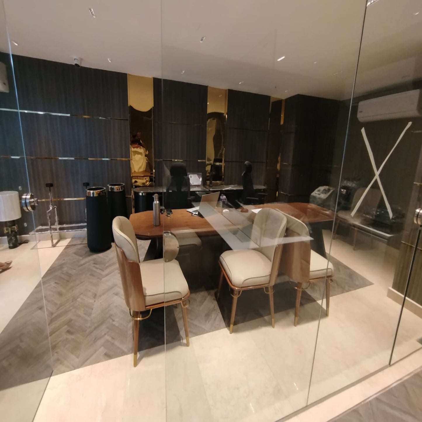 Bank manager room with a table and chairs in a modern interior setting.