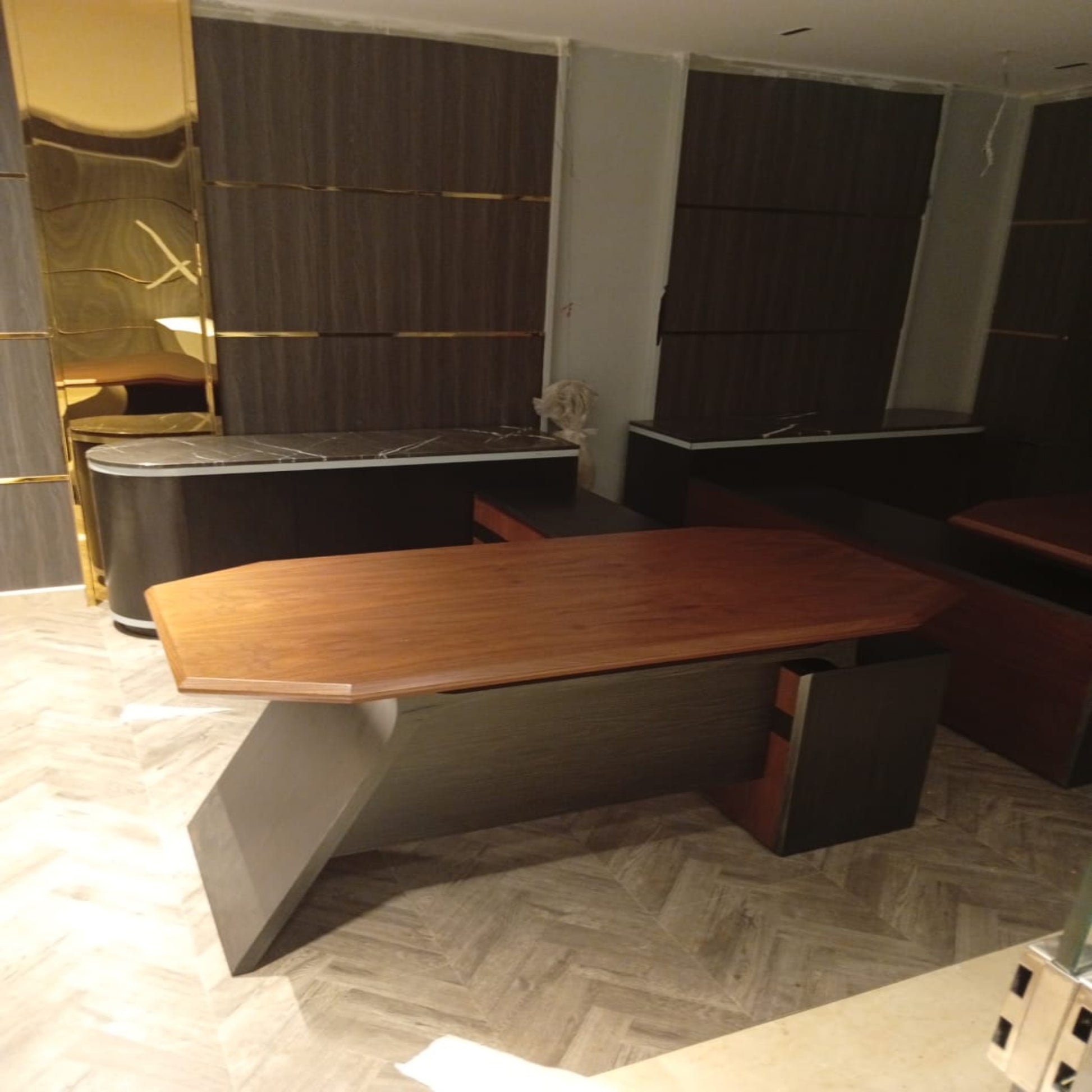 Modern office desk with a gold accent in an indoor setting